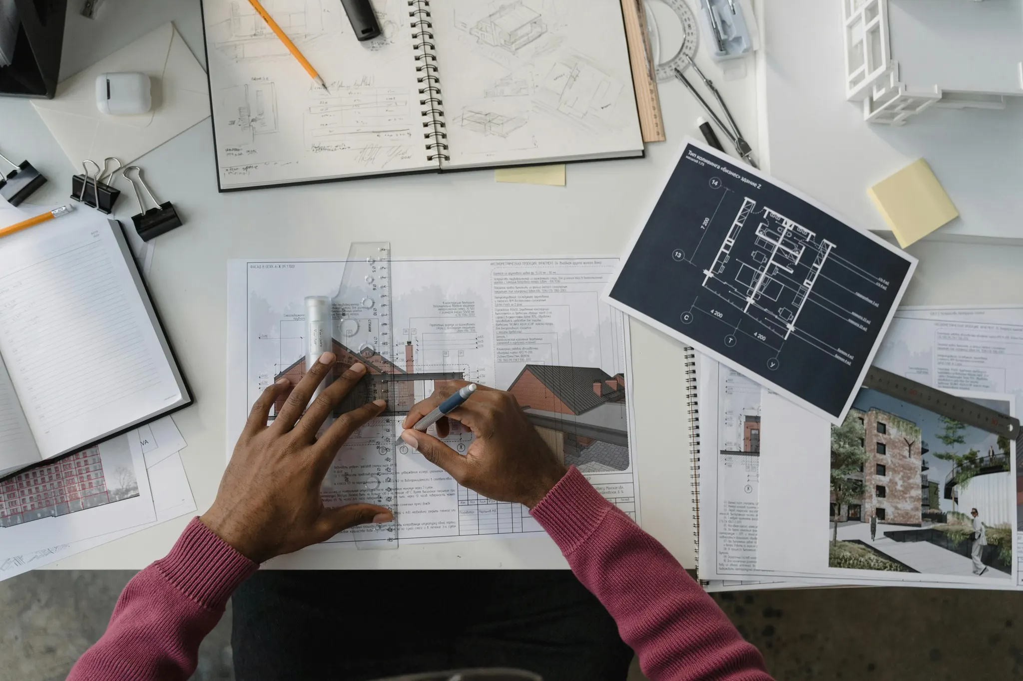 Architect marking up construction drawings